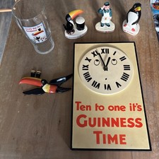 Guiness collectables, toucan, figurines, glass and Clock 