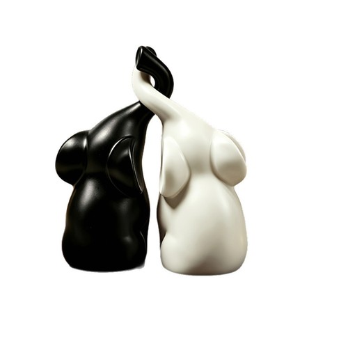 Intertwined elephant statue - intertwined,