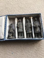 A SET OF 4 CHINESE FIGURINES -