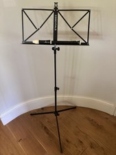 Adjustable, collapsible, portable music stand with carry case.