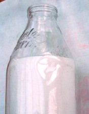 Vintage old milk bottle. Dale
