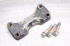 Fork bridge cover above Suzuki