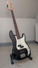 Squier Precision Bass by Fender, Black and White comes with hard case. 
