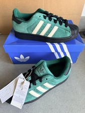 Pair of Green Adidas Superstar