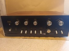 vintage sansui AU-555A solid state stereo integrated amplifier powers up