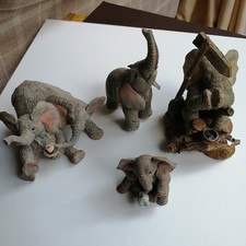 FOUR TUSKERS  ELEPHANTS