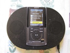 Sony NWZ-E444 MP3 Music Player and Sony SRS-NWGT014E Active Speaker System.