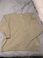 Rita Ora dark beige jumper