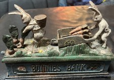 Vintage Mechanical Cast Iron Bunnies Bank Money Box - used. Needs TLC
