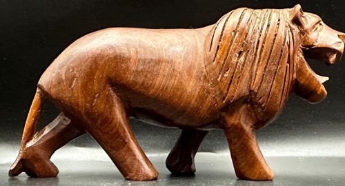 Hand carved wooden lion - hand,