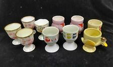 Selection of egg cups - owls, pigs, flowers, duck, hen