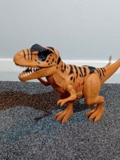 T Rex Dinosaur Eyes Light Up And Makes A Roaring Noise When Press A Button