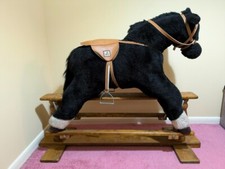 Mamas and Papas traditional rocking horse with saddle, bridle and stirrups