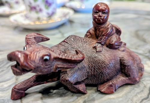 Asian buffalo monk figure - monk, hand