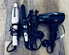 Hair styling devices (2 hair straighteners, a curling device, and a hair dryer)