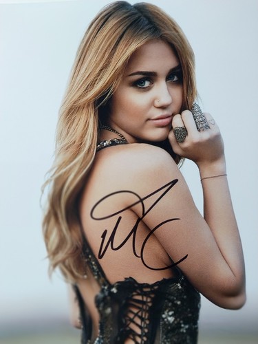 Miley cyrus autographed 8x10 - cyrus,