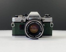 Olympus OM10 35mm SLR Film Camera w Zuiko 50mm 1.8 Lens Green Leathe NEW SEALS