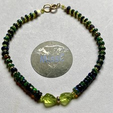 9CT GOLD BLACK FIRE OPAL AND PERIDOT LEAF  BRACELET, HANDMADE BY MISSC