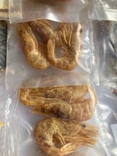 Sea fishing bait, salted mackerel,squid, & prawns in small packs.