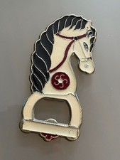 Vintage brass and enamel hobby horse shaped bottle opener