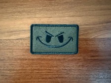 Russian Evil Smiley Face Badge