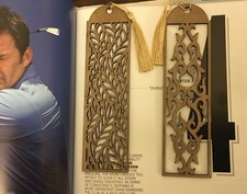 Two wooden bookmarks with - two,