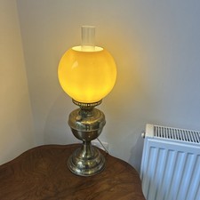 Antique Victorian brass oil lamp converted to electric with Amber colour shade