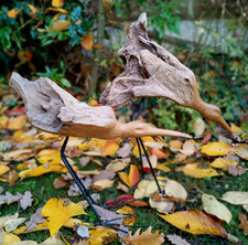 Two artist hand carved wood bird sculptures on metal legs : 21" : 54 cms tallest