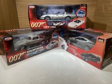 ERTL JOYRIDE 1:18 JAMES BOND TRIPLE SET ASTON MARTIN DBS DB5 CORVETTE GOLDFINGER