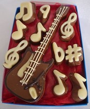 Hand-made chocolate electric guitar & musical notes
