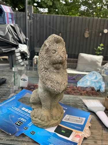 Weathered cast stone lion - weathered,