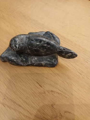 Carved seal rock - carved,