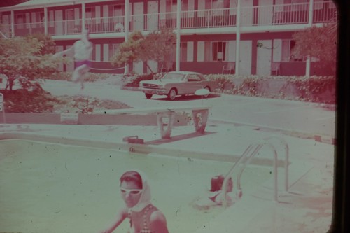 1960s man diving pool - diving, motel