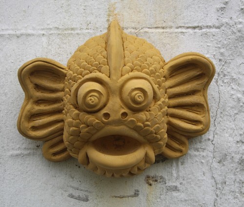 Goldfish eating fly gargoyle - goldfish,
