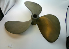 Antique brass boat motor