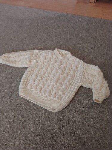 Hand knitted aran - hand,