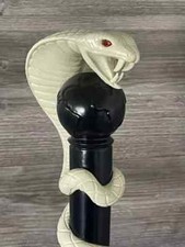 Hand craved snake handle