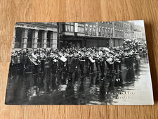 1940s or 50s photo postcard . military band marching through salisbury