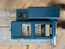 Coin operated electric meter