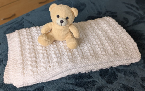 Hand crafted knitted baby - hand,