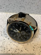 American Exchange Gold and brown watch, good working order. 