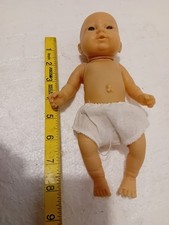 Small rubbery cute pretty NEWBORN STYLE nude baby doll - closed eyes - 10"