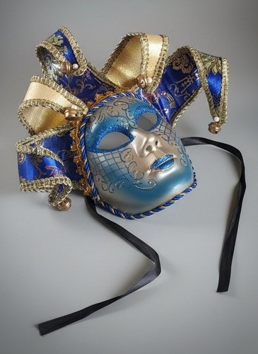 Dramatic blue gold jester - &,