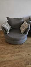 corner suite and matching swivel chair with cushions