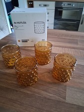 IKEA HUTLÖS 4 X AMBER GLASS TEALIGHT HOLDERS - NEW/BOXED
