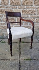 A Regency mahogany dining elbow chair