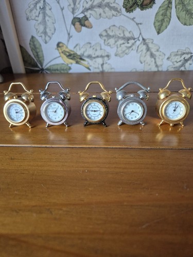 Set miniature alarm - of,