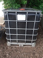 IBC 1000 litre diesel storage tank on metal pallet with valve