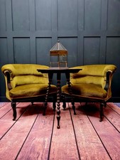 Pair of late victorian aesthetic movement green velvet low wing back armchairs