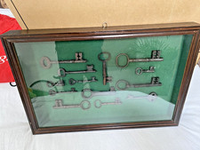 Vintage old antique keys in wooden display case